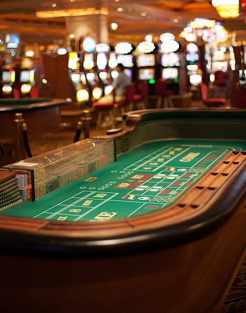 Baccarat live dealer table with card display and studio lighting